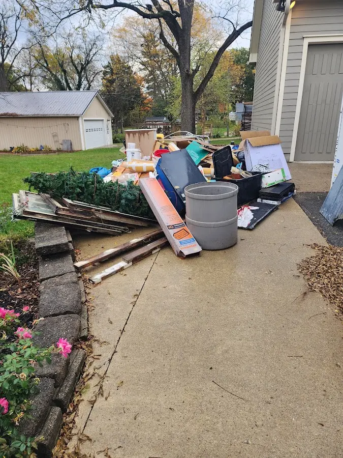 Dumpster being loaded with debris for Residential Dumpster Rental in North Castle